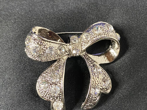 Vintage silver tone rhinestone bow brooch